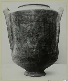 Pottery White Painted I amphora with two handles and diamond and band decoration, photographed on a plain background.