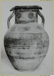 Two-handled pottery jar, White Painted IV, with concentric circle motifs on the neck and shoulder and painted bands on the body