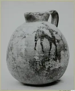 Bichrome IV jug with a strap handle and a painted animal figure on its globular body.