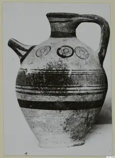Painted pottery jug with a spout, strap handle and concentric circles on the shoulder, Pottery Bichrome III