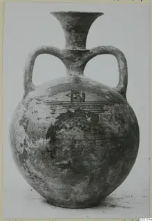 Black-on-Red I-III pottery: two-handled globular jug with a flaring neck and painted concentric bands