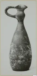 Pottery jug with a loop handle, long neck and pear-shaped body