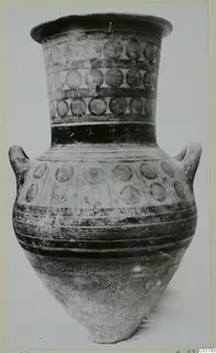 Two-handled jar with a flaring rim, painted with bands of concentric circles and dark horizontal stripes
