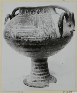 Pottery Bichrome IV vessel with loop handles, a wide body and a tall ring-footed stem, shown on a plain background