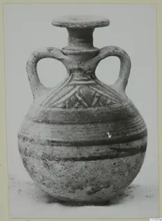 Round-bodied jug with two loop handles, a flat-rimmed neck and painted bands and triangles on the shoulder.