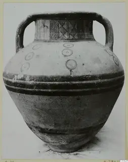 Two-handled jar with painted neck panels and concentric circles on the shoulder