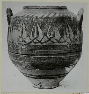 Two-handled painted pottery jar with pointed drop-shaped motifs and painted bands around the body