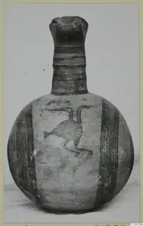 Globular jug with a tall neck, painted with horizontal bands and a long-necked bird on the body