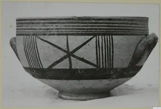 Pottery White Painted III-1: a two-handled bowl with horizontal rim bands, vertical stripes and a crossed-diagonal motif painted on its body
