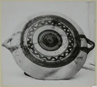 Pottery Bichrome III: round painted vessel with two handles and a pattern of concentric rings and a wavy band
