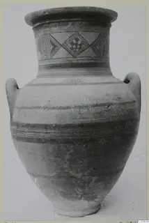 Painted two-handled jar with diamond motifs on the neck and banded decoration on the body, shown against a plain background.