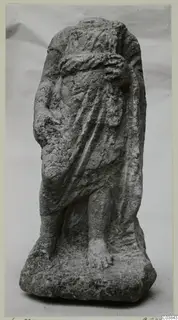 Stone statue of a standing draped figure from Soli, with the head and upper body worn away