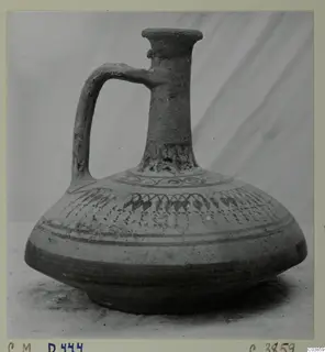 Jug with a single loop handle, flared mouth and dark painted bands on the body