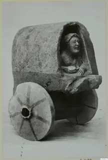 Limestone model cart from Mersinaki with a seated female figure in its covered body