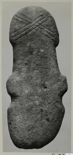 Back of a stone idol from Petra tou Limniti, elongated form with incised crossed lines at the rounded top end