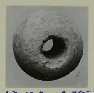 Thick ring-shaped object with a large central hole, seen close up