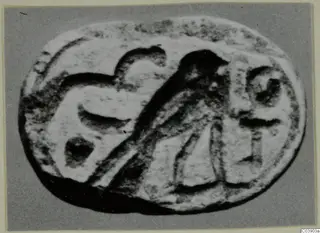Oval engraved stone seal from Amathus, with a bird and other motifs carved on its face