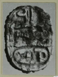 Engraved stone seal from Amathus, shown enlarged, with a ridged domed back and an oval engraved base