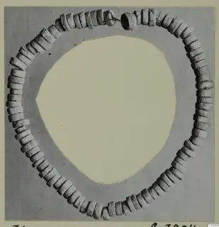 Necklace of disc-shaped pale stone beads laid in a ring, from Amathus
