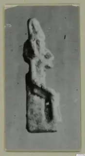 Small figure of Sekhmet from Amathus, shown upright against a plain grey ground in a photograph.