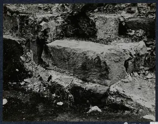 Large cut stone block among rubble and stone courses at the theatre at Soli during excavation