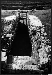 Excavated trench with stone-faced sides and steps at the theatre at Soli