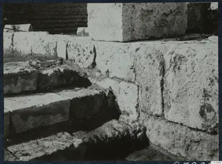 Stone steps and masonry blocks of the theatre at Soli during excavation