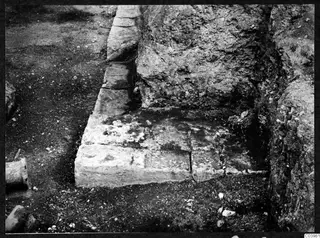 Excavated stone blocks and earth face at the theatre at Soli