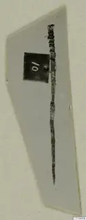Long, slender metal object with a coiled upper end, from Lapithos Tomb 322 B