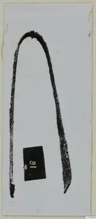 Bronze toilet requisite from Lapithos: a bent metal implement shaped like tweezers, with a number label beside it.