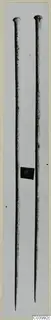 Two long bronze pins with knob-shaped heads from Lapithos Tomb 322A, photographed upright