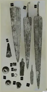 Long blades, tools, beads and rings from Lapithos Tomb 313 C-D, laid out on a pale background with numbered labels