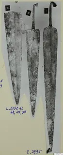 Three corroded bronze blades with tangs, from Lapithos Tomb 313 C-D.