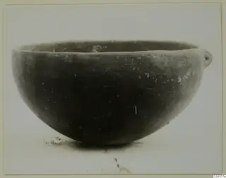 Pottery Red Polished III bowl from Lapithos, Vrysi tou Barba tombs, shown in profile against a pale background