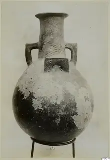 Pottery Red Polished III amphora with two handles and incised decoration on the neck and shoulder