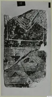 Idols, a broken flat object with incised chevron and hatched band patterns, from Lapithos