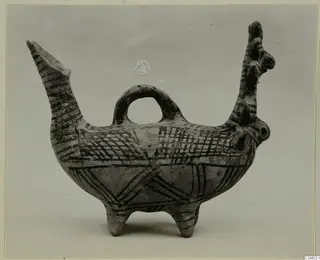 Pottery vessel with a long spout, a loop handle and dark painted bands and cross-hatching, White Painted II