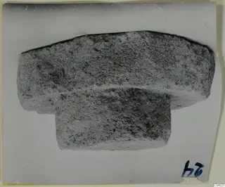 Stone cover from Lapithos Tomb 408, a broad slab resting on a narrower block