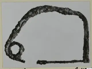 Corroded bronze object with a loop, from the Kastros tombs at Lapithos