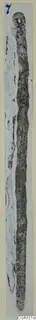 Bronze tools from Arsos: two long, narrow metal objects shown side by side on a pale card.