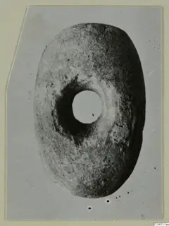 Disc-shaped object with a large central hole, small find from Idalion