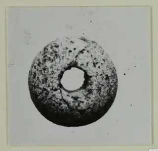 Round disc-shaped find with a central hole, from the Idalion small finds series