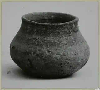 Pottery vessel V. 1.85 from Vouni: a squat jar with a short wide neck and rough grey-brown surface