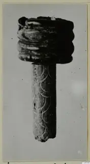 Bone object with a ridged top and an incised arc pattern on its shaft, from Idalion