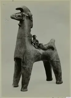 Terracotta horse-shaped figure with a small seated human figure on its back