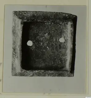 Square fragment with a raised rim, from Idalion, seen from above on a mounted card.