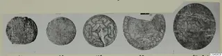 Five disc-shaped objects from Enkomi Tomb 6, some with incised patterns, photographed in a row on a mount