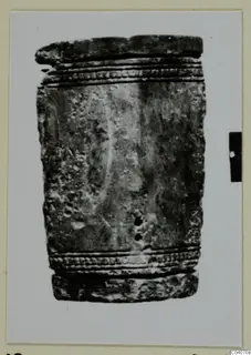 Cylindrical object from Enkomi with ridged, dotted bands at top and bottom and a row of small holes