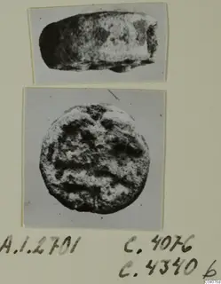 Two small stone objects from Ayia Irini, one seen from the side and one from above.
