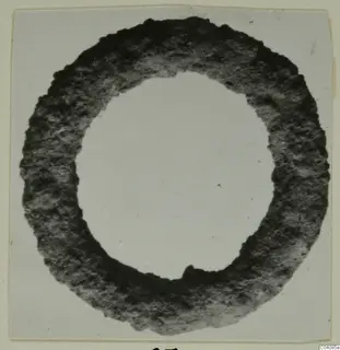 Ring from Marion, a thick ring with a rough, corroded surface against a plain pale background.
